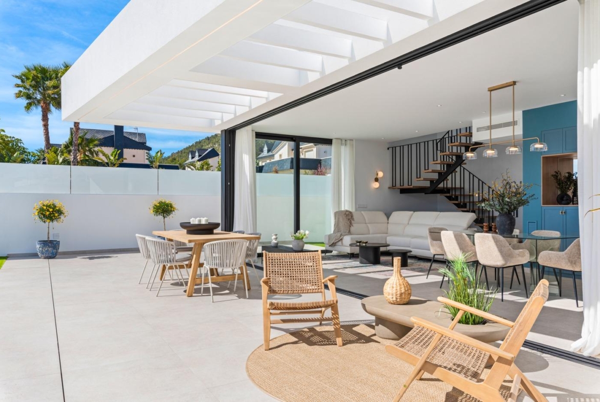 Sun-drenched open-plan terrace and living area of modern 3-bedroom villa with sleek design in Polop, Costa Blanca