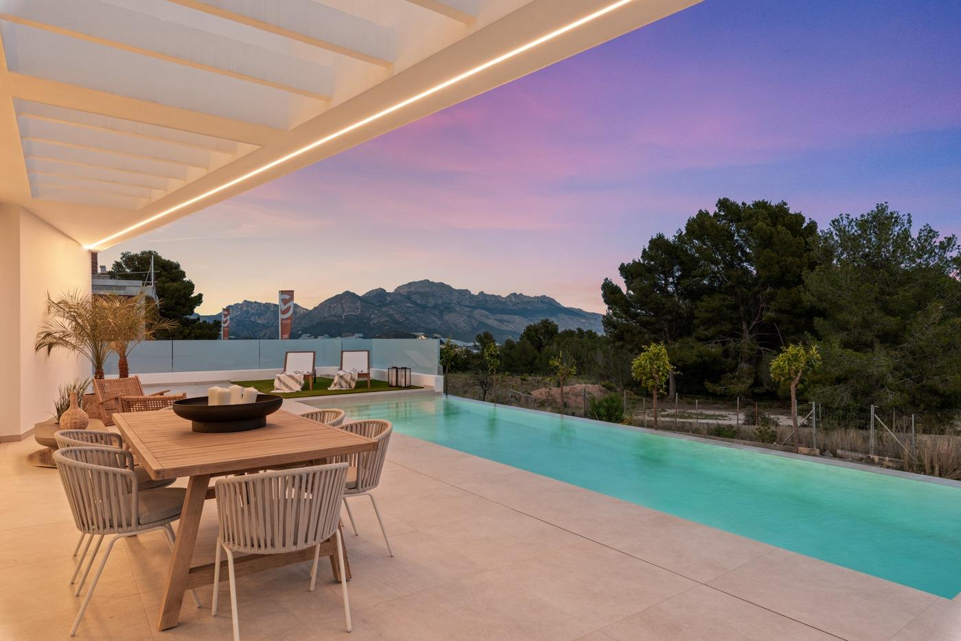 Modern 3-bedroom villa in Polop, Costa Blanca featuring a spacious sun-drenched terrace and sleek private pool with mountain views.