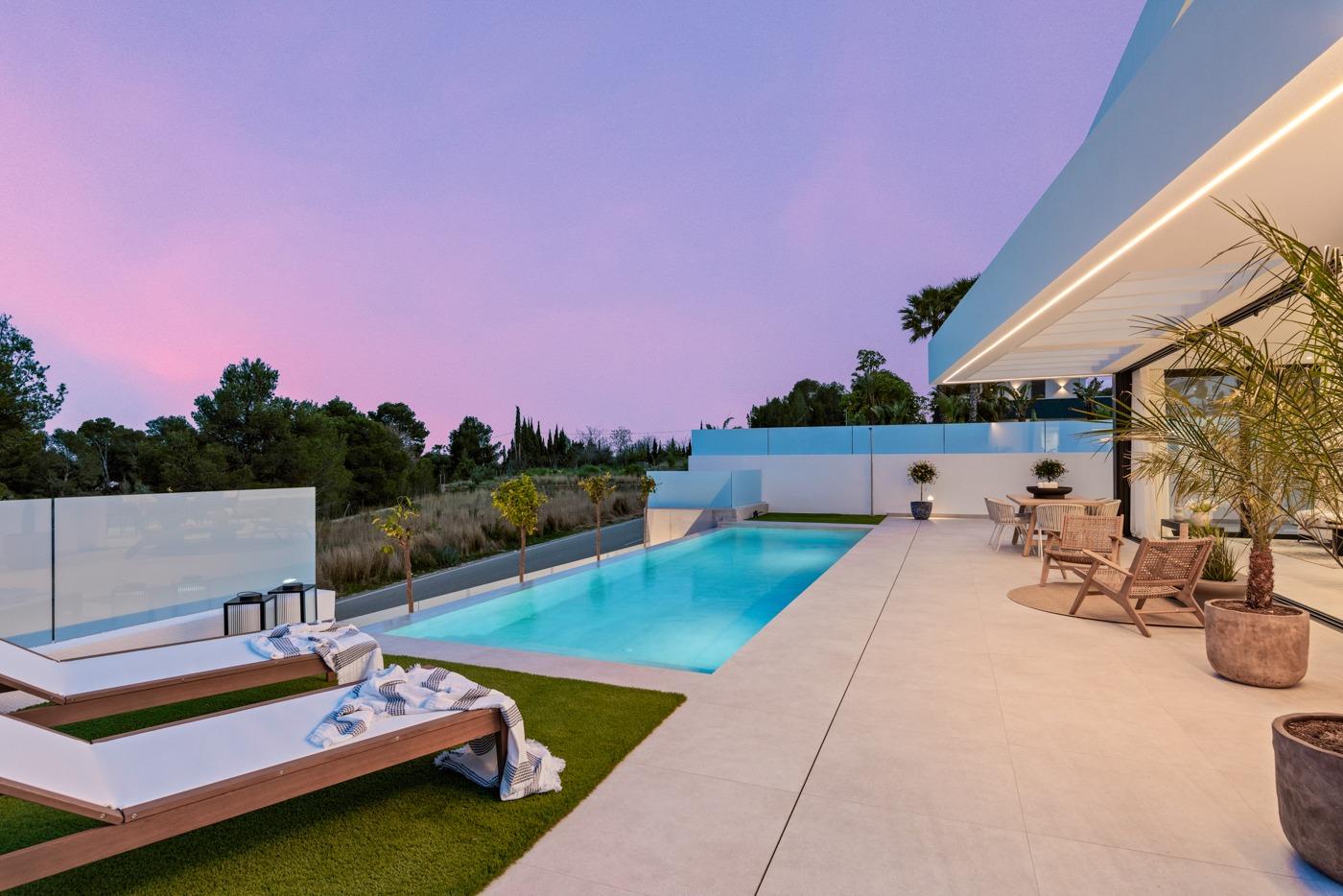 Elegant new build 3 bedroom villa in Polop, Costa Blanca with sleek private pool, spacious terrace, and serene twilight views.