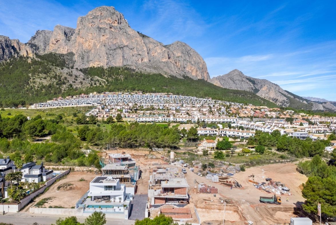 Spacious new build 3 bedroom villa with private pool under construction, set against dramatic Polop mountain backdrop, Costa Blanca.
