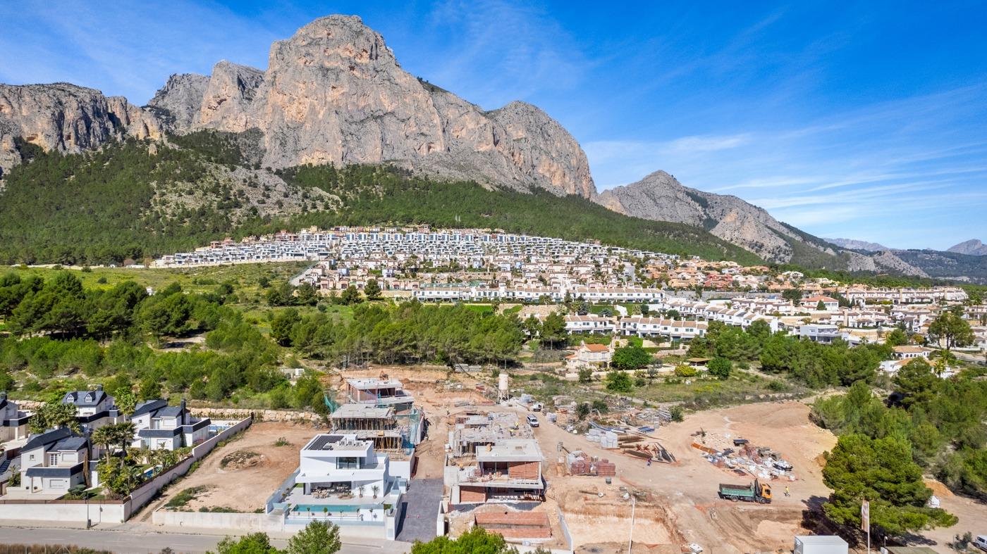 Spacious new build 3 bedroom villa with private pool under construction, set against dramatic Polop mountain backdrop, Costa Blanca.