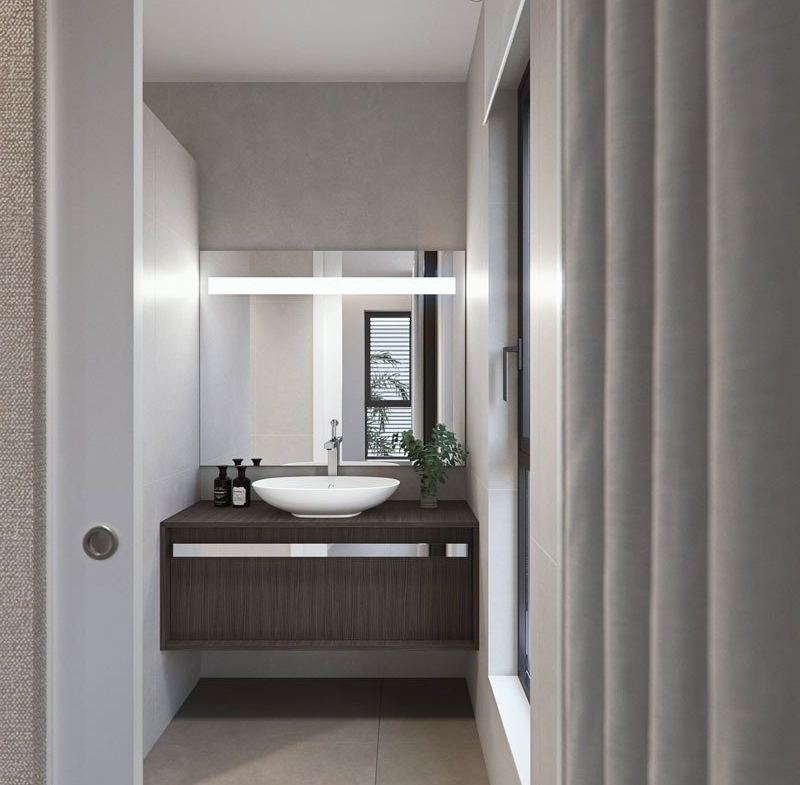 Modern, sleek bathroom with floating vanity and illuminated mirror in new build villas in Torre de la Horadada