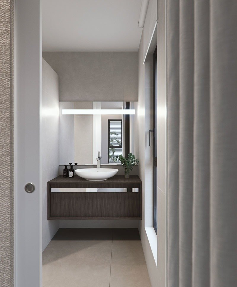 Modern, sleek bathroom with floating vanity and illuminated mirror in new build villas in Torre de la Horadada
