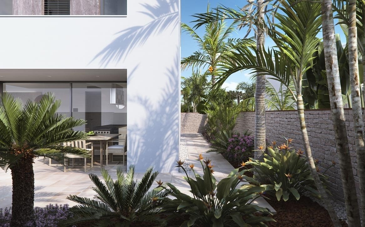 Modern luxury villa exterior with lush landscaped garden and sunlit terrace in Torre de la Horadada new build villas