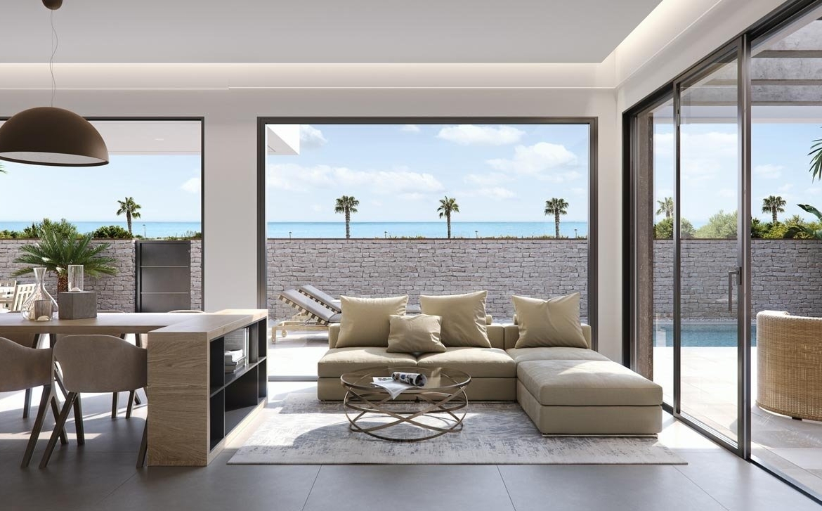 Bright open-plan living area with modern furniture and sea views in new build villas in Torre de la Horadada
