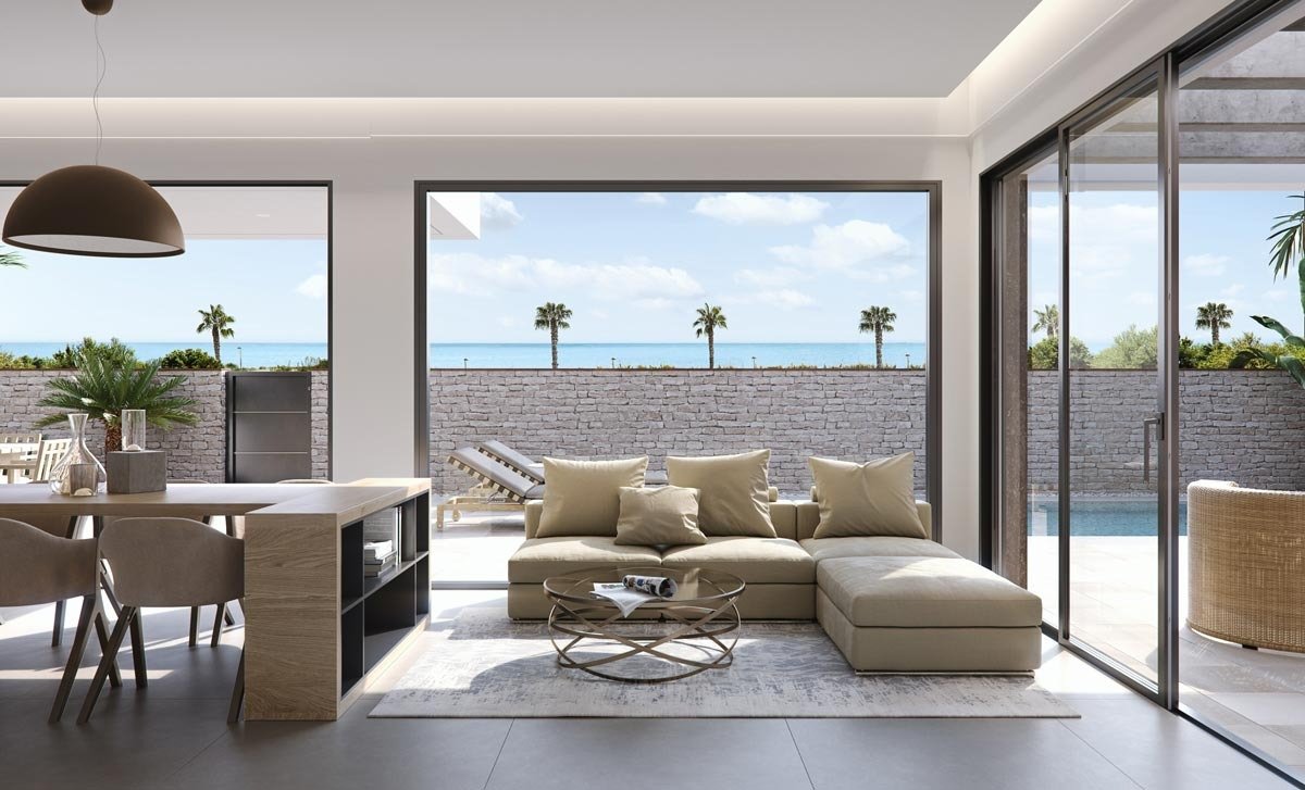 Bright open-plan living area with modern furniture and sea views in new build villas in Torre de la Horadada