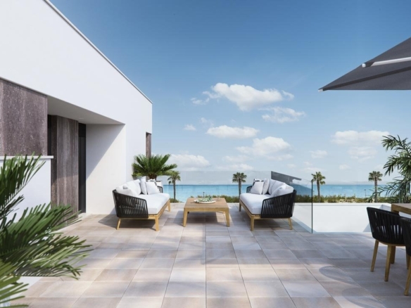 Sun-drenched terrace with modern outdoor seating and panoramic sea views at luxury new build villas in Torre de la Horadada