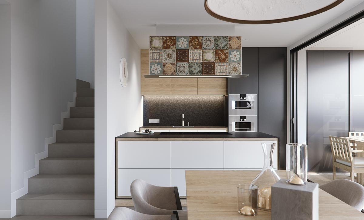 Modern, bright open-plan kitchen and dining area in new build villas in Torre de la Horadada with elegant tile backsplash.