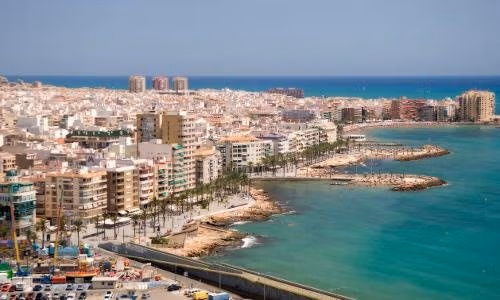 NEW-BUILD-VILLAS-IN-TORREVIEJA-12 Panoramic sunlit coastline and urban landscape near modern new build 3 bedroom villa in Aguas Nuevas, Torrevieja