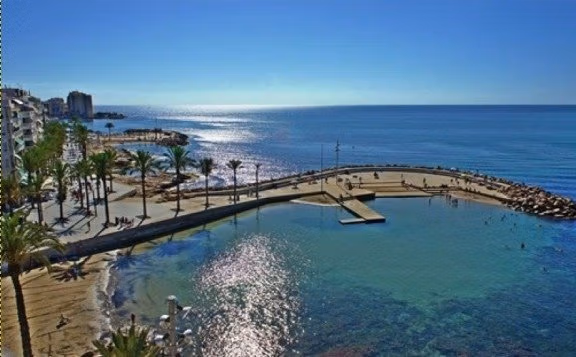 NEW-BUILD-VILLAS-IN-TORREVIEJA-13 Sun-drenched panoramic coastline with shimmering turquoise waters near modern new build villa in Aguas Nuevas, Torrevieja