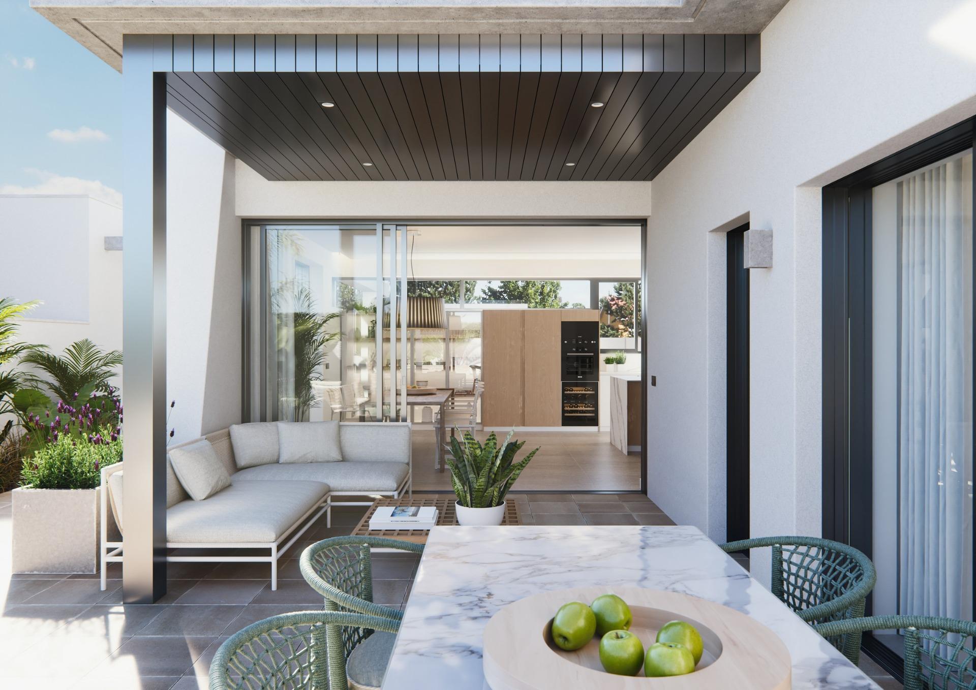 Spacious sun-drenched terrace with modern seating and dining area in a new built villa on a floor.