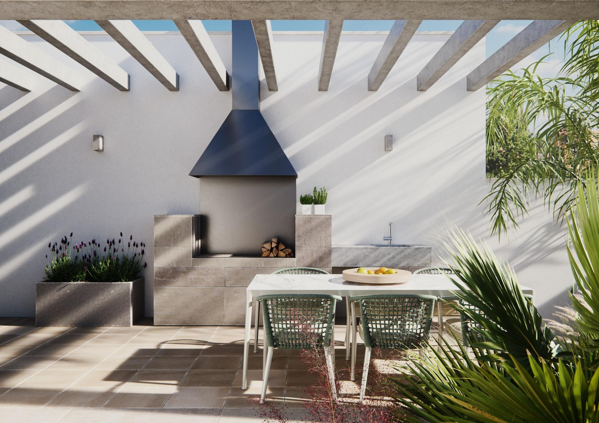 Sun-drenched outdoor dining area with modern built-in barbecue and lush greenery in new built villa on a floor
