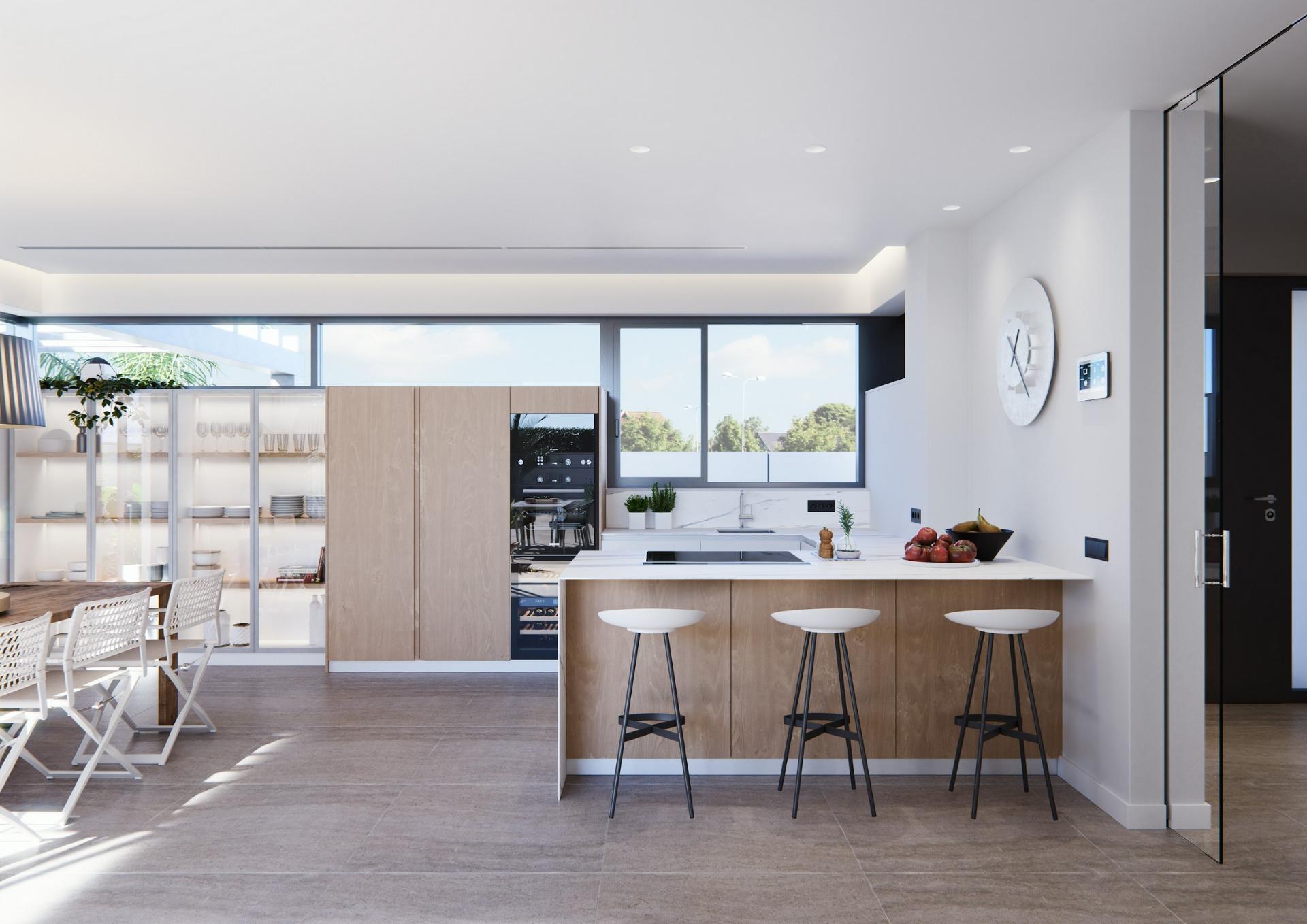 Bright, modern kitchen with sleek wood cabinetry and breakfast bar in a newly built villa on a floor, sunlit and airy.