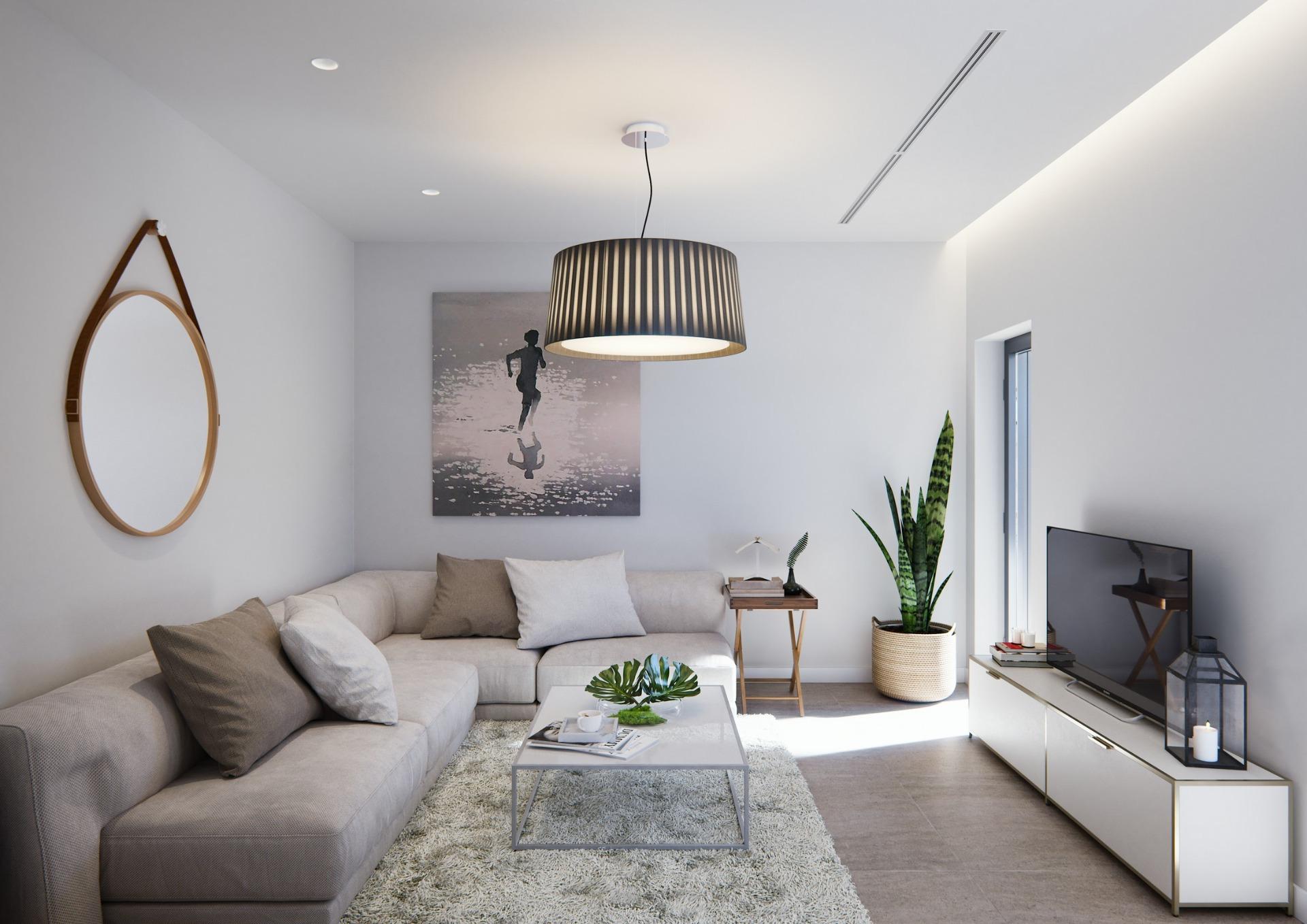 Bright, elegant living room in a new built villa on a floor featuring a spacious sofa, modern décor, and natural light.