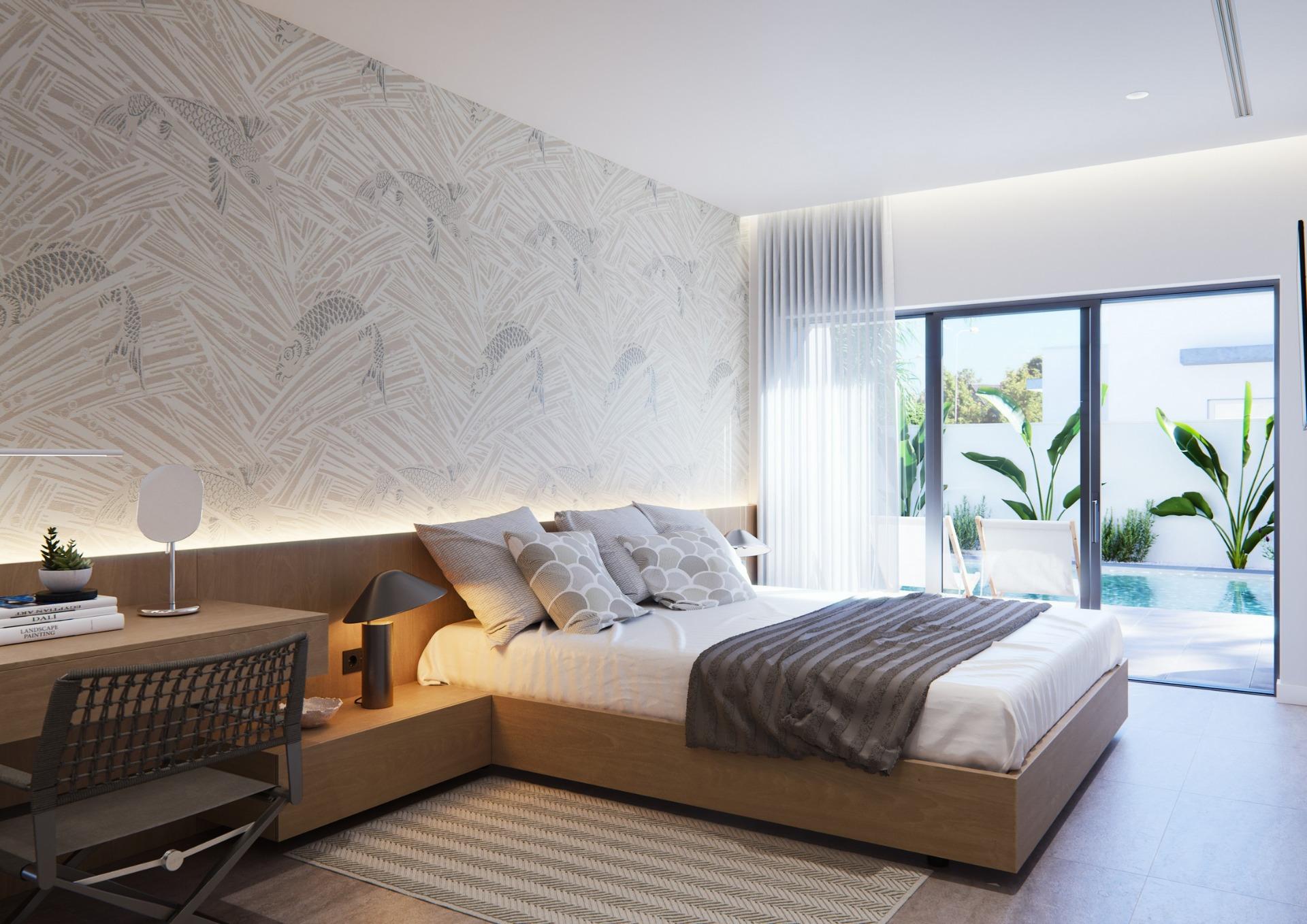 Sunlit, modern bedroom in new built villa on a floor with elegant decor and sliding doors opening to a private pool terrace.