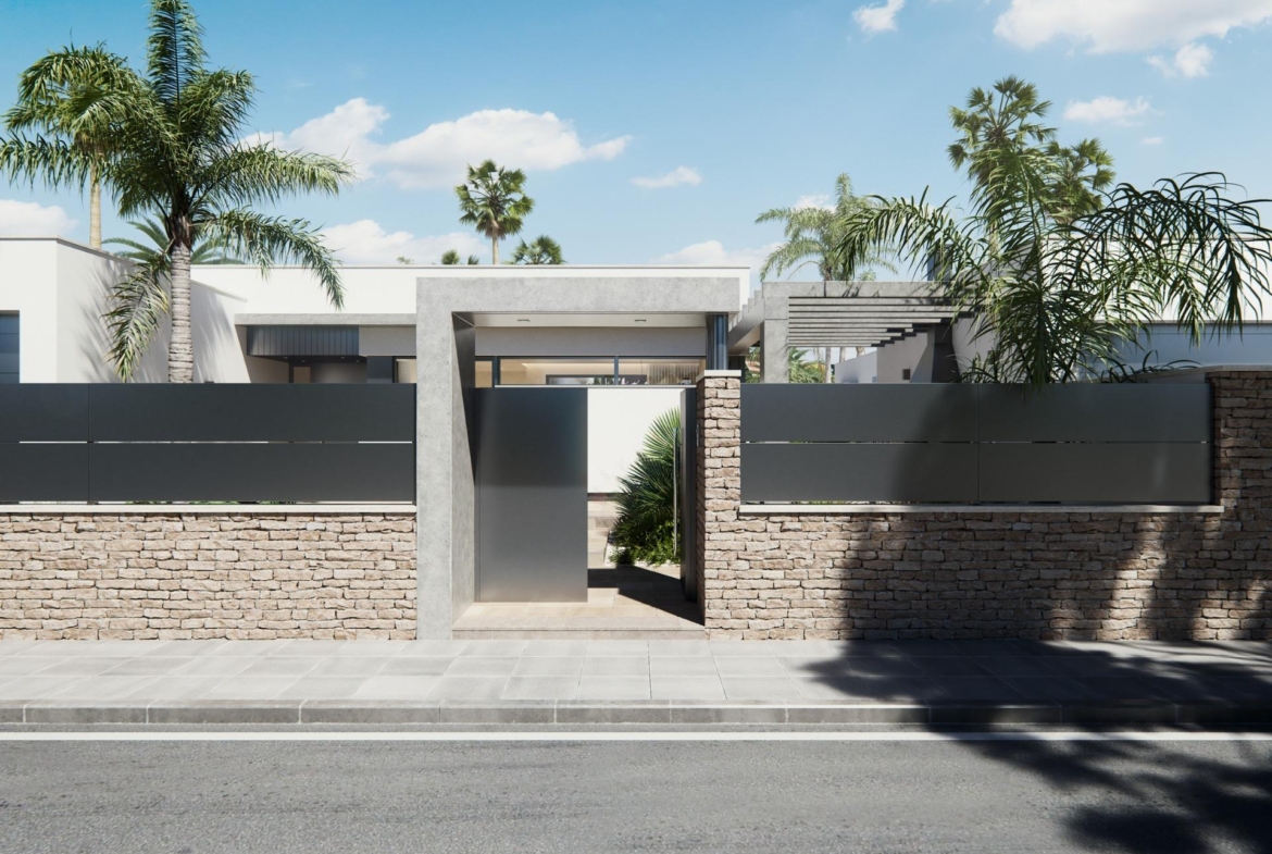 Modern new built villa entrance on a floor with sleek stone walls, metal gates, and lush tropical landscaping under a clear sky