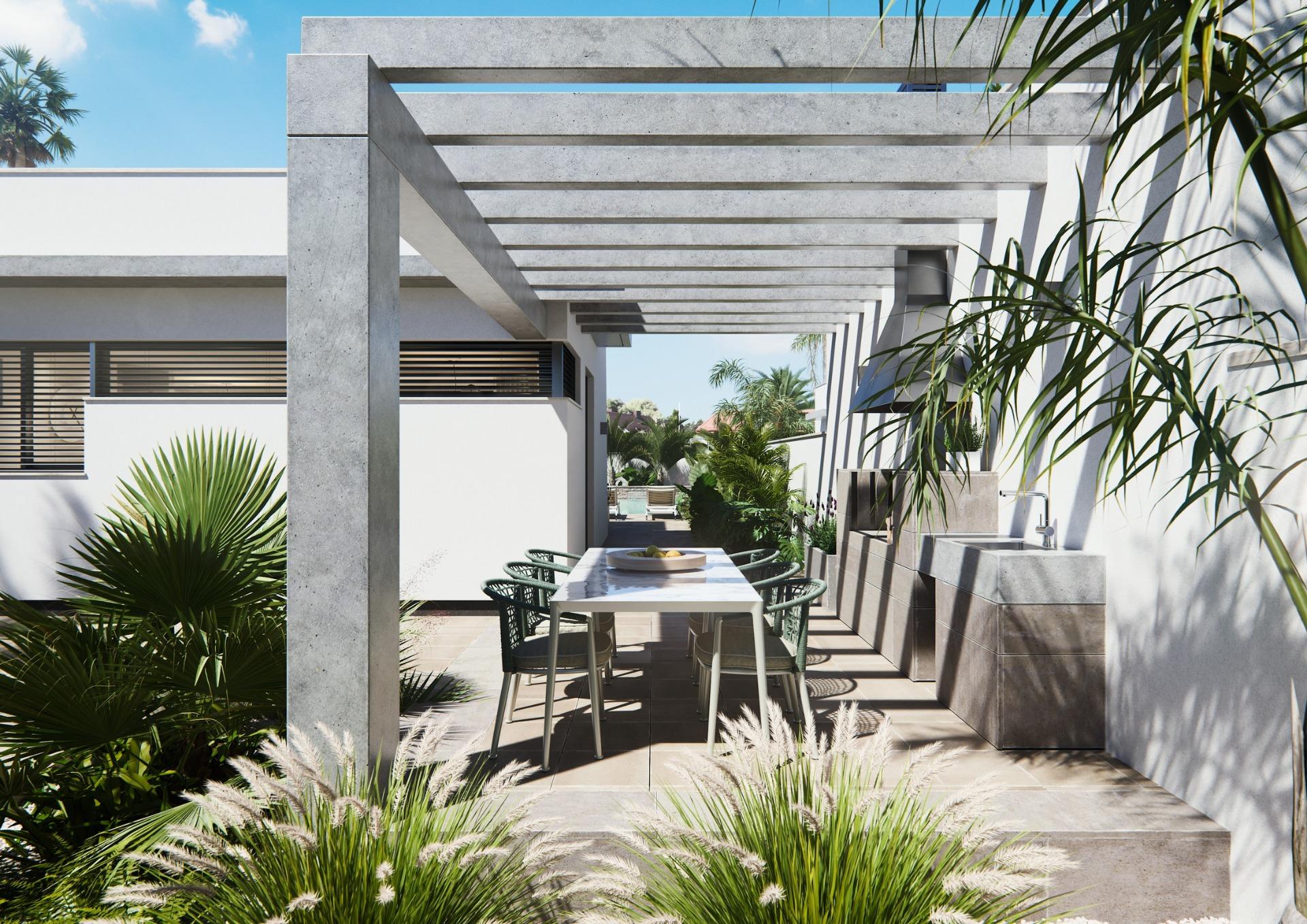 Modern new built villa on a floor with elegant shaded outdoor dining terrace surrounded by lush greenery and tropical plants