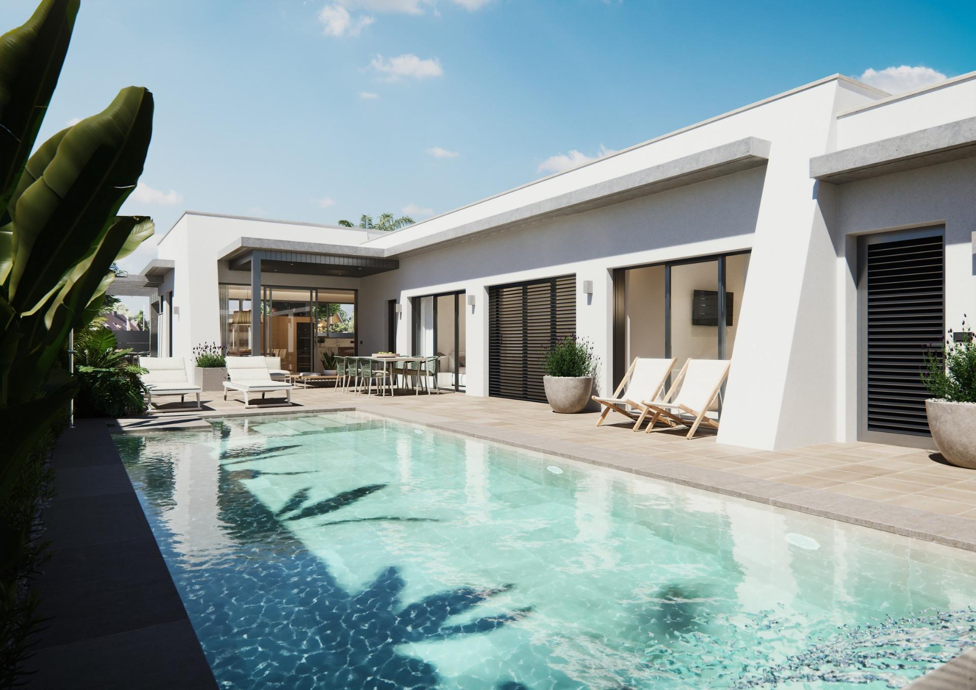 Modern new built villa on a floor featuring a spacious sunlit terrace and inviting private swimming pool under clear blue skies