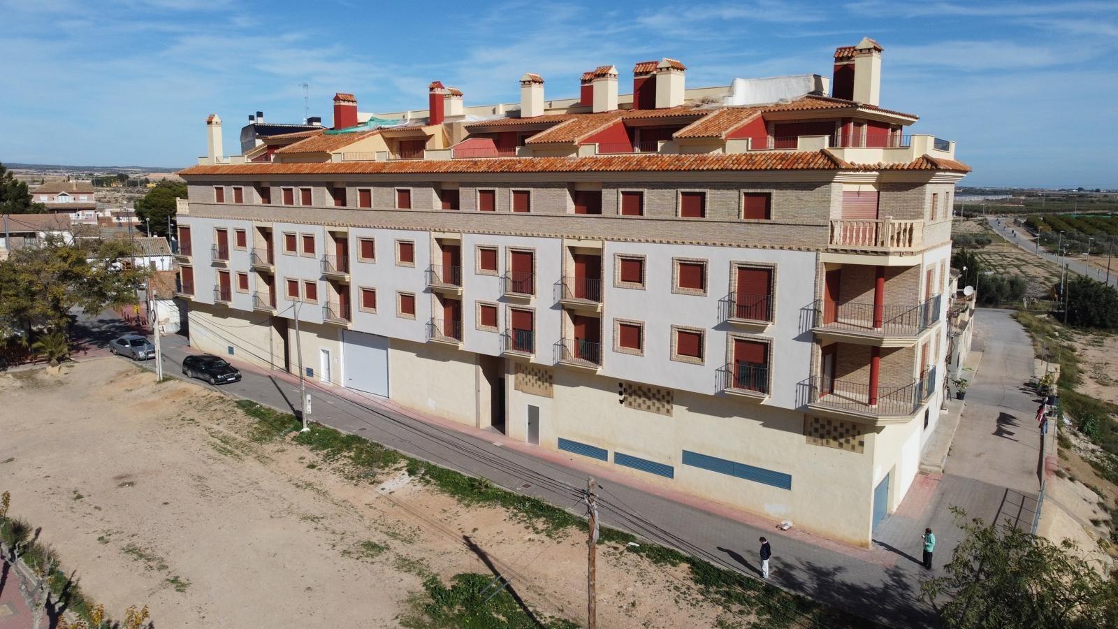 Bright new build 1-bedroom apartment complex with terracotta roofs and balconies in sunny Avileses, Murcia.