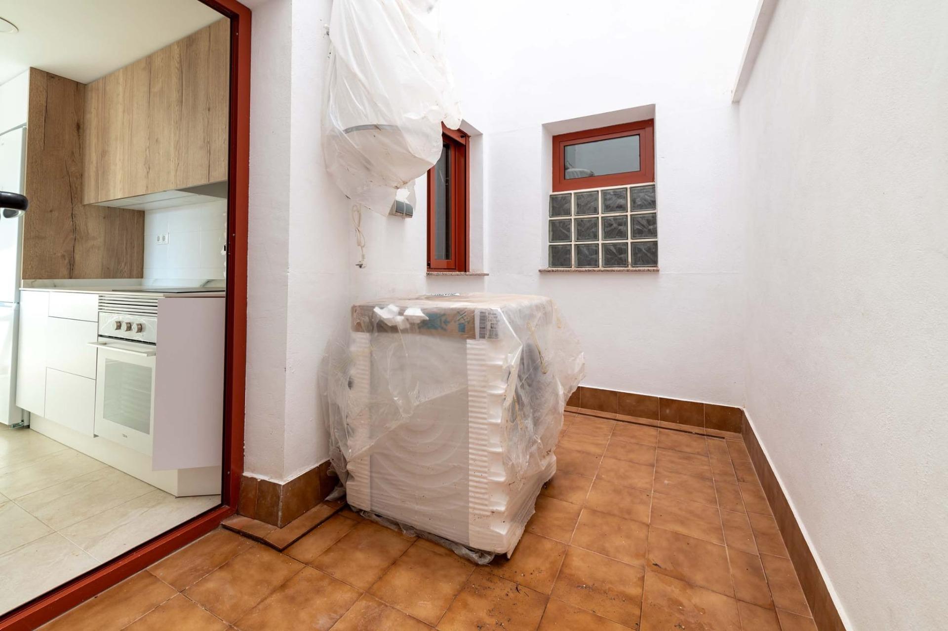 Bright private terrace adjacent to a modern kitchen in an affordable new build 1 bedroom apartment in Avileses, Murcia