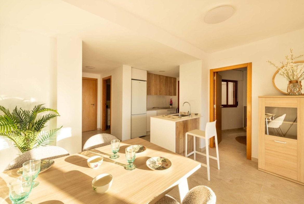Bright, modern new build studio apartment in Avileses, Murcia with sunlit open-plan kitchen and dining area.