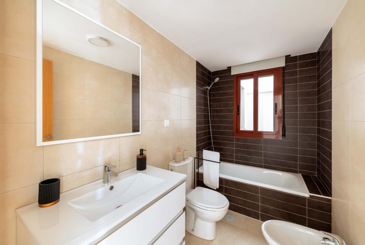 Modern bathroom with sleek fixtures and contrasting tiles in an affordable new build studio apartment in Avileses, Murcia