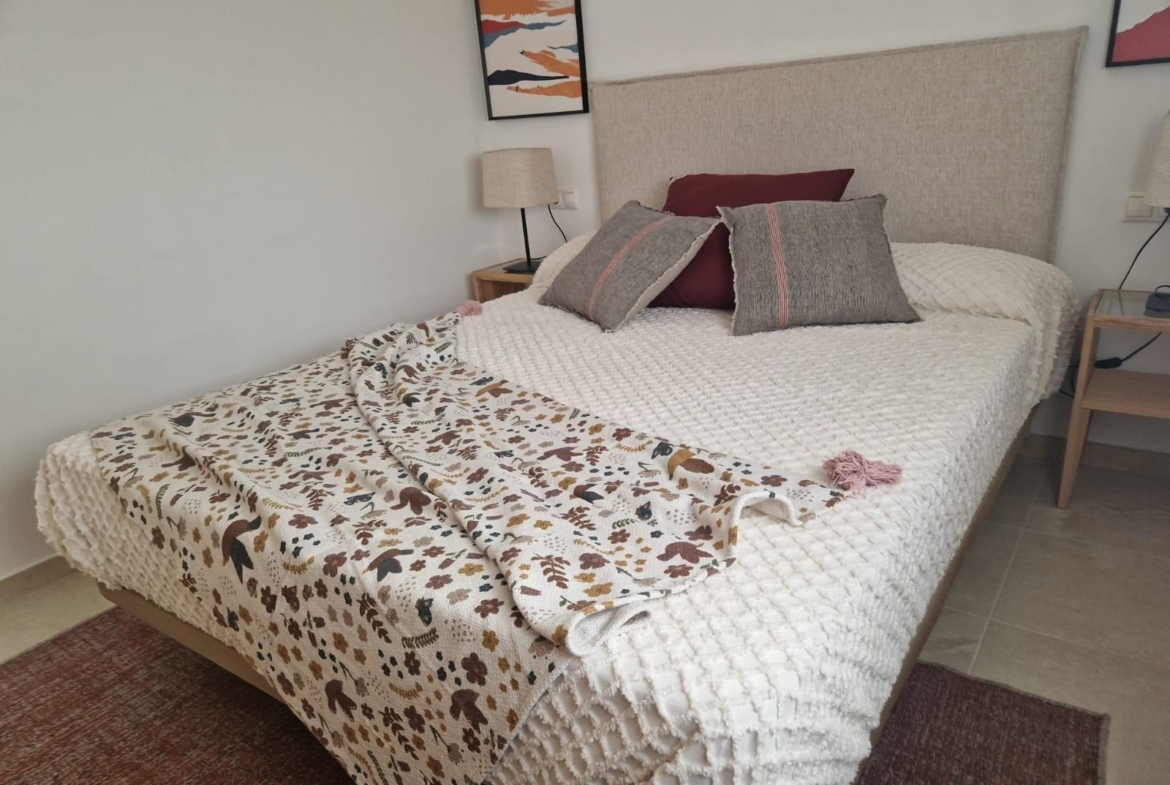 Cozy, elegantly styled bedroom in a new build 1 bedroom apartment in Avileses, Murcia with soft neutral tones and modern decor.