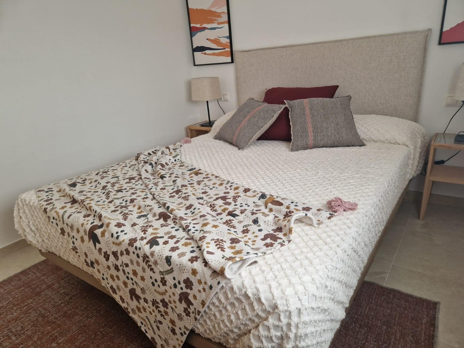 Cozy, elegantly styled bedroom in a new build 1 bedroom apartment in Avileses, Murcia with soft neutral tones and modern decor.