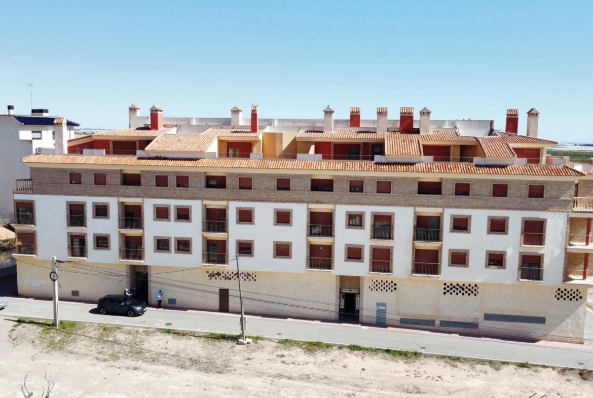 Modern new build studio apartment complex with bright terracotta roofs and spacious balconies in Avileses, Murcia.