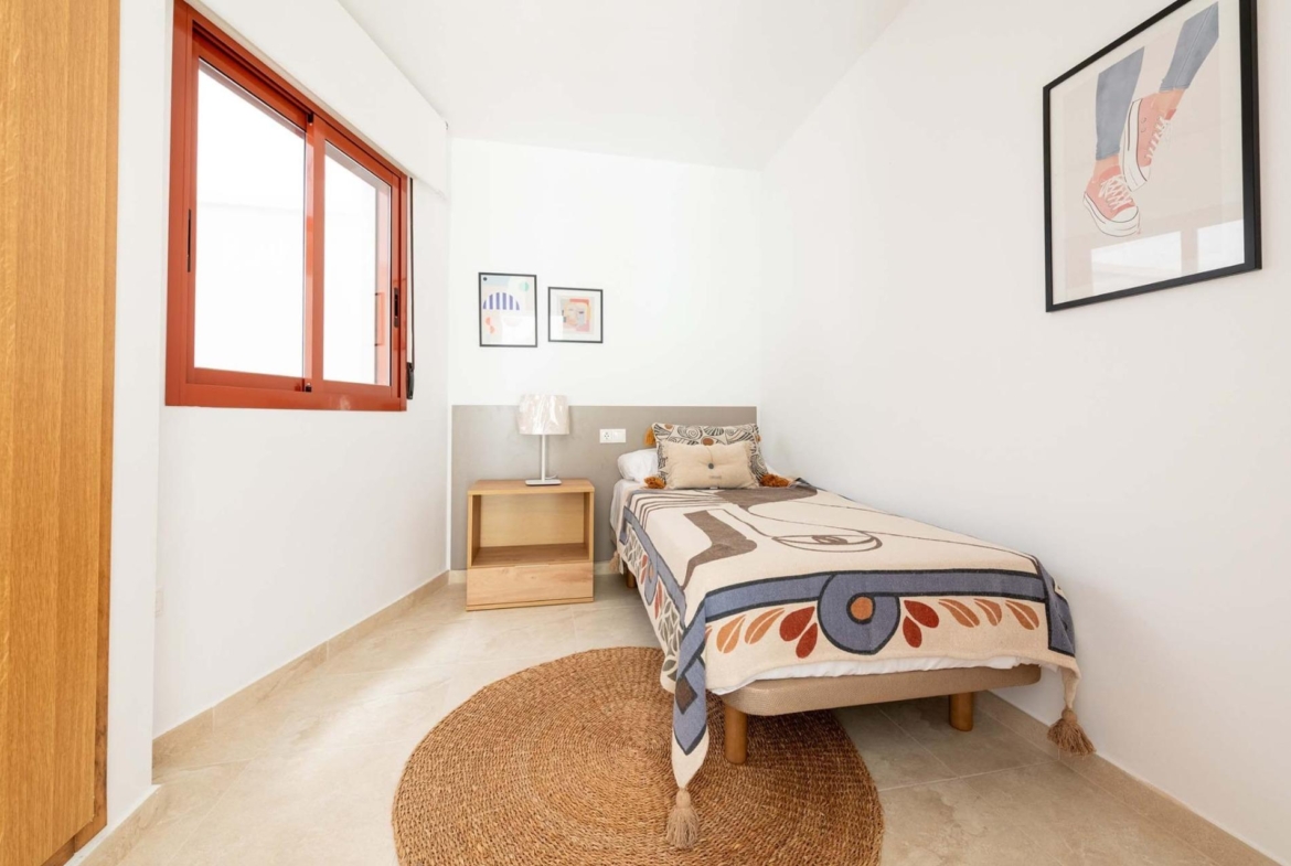 Bright and cozy bedroom in a new build 1-bedroom apartment in Avileses, Murcia, featuring modern decor and natural light.