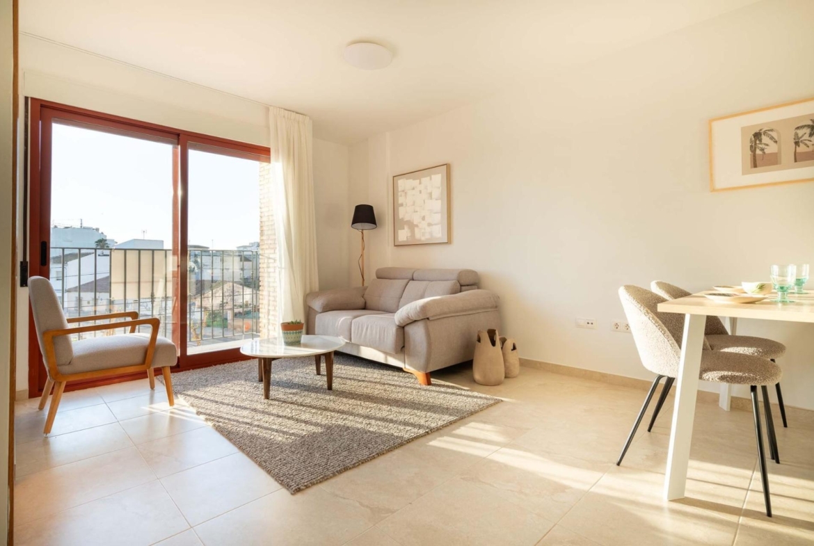 Bright and modern 1-bedroom apartment living area in Avileses, Murcia, featuring sunlit open-plan design and balcony views.