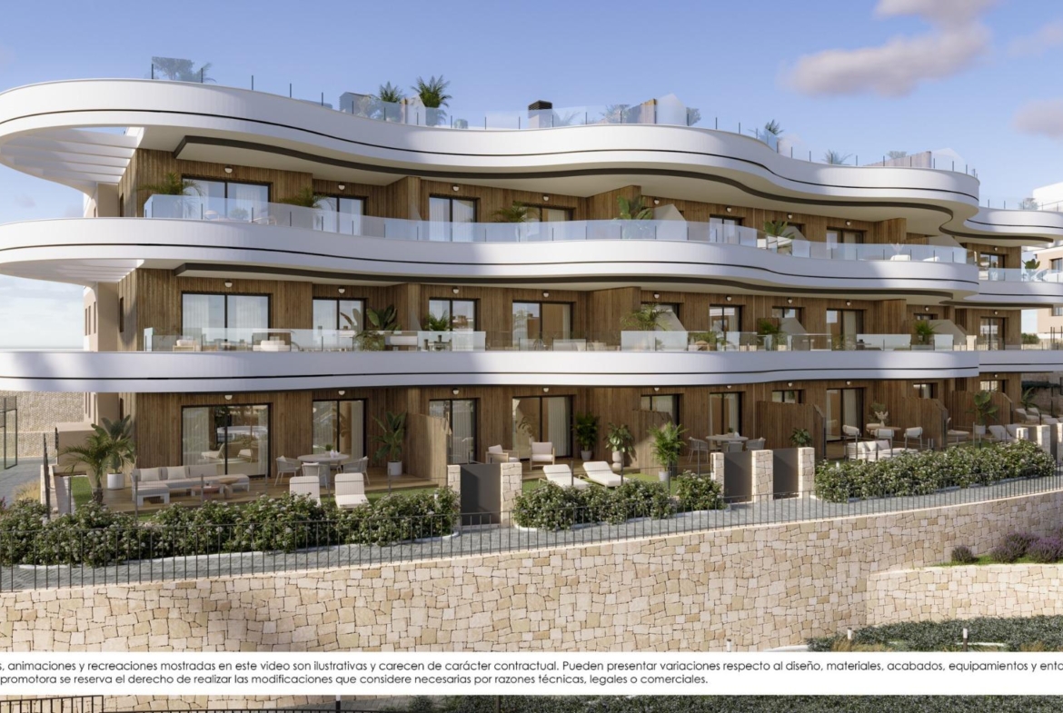 Modern new build apartments in Finestrat with spacious terraces, elegant glass railings, and lush greenery surrounding the exterior.