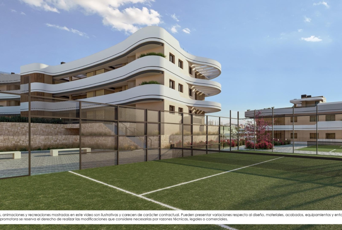 Modern new build apartments in Finestrat with sleek curved balconies overlooking a lush, private sports court under clear skies.