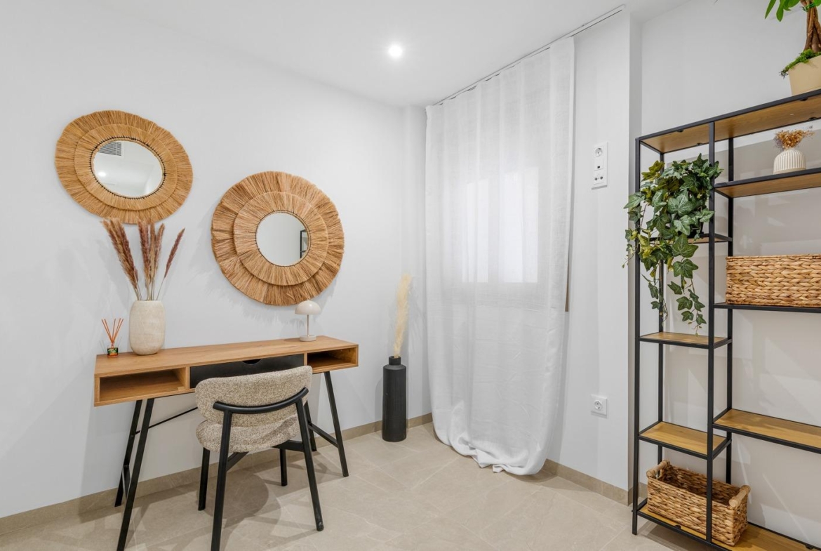 Bright modern study corner in a stylish 3-bedroom new build apartment in Jacarilla with elegant decor and natural light.