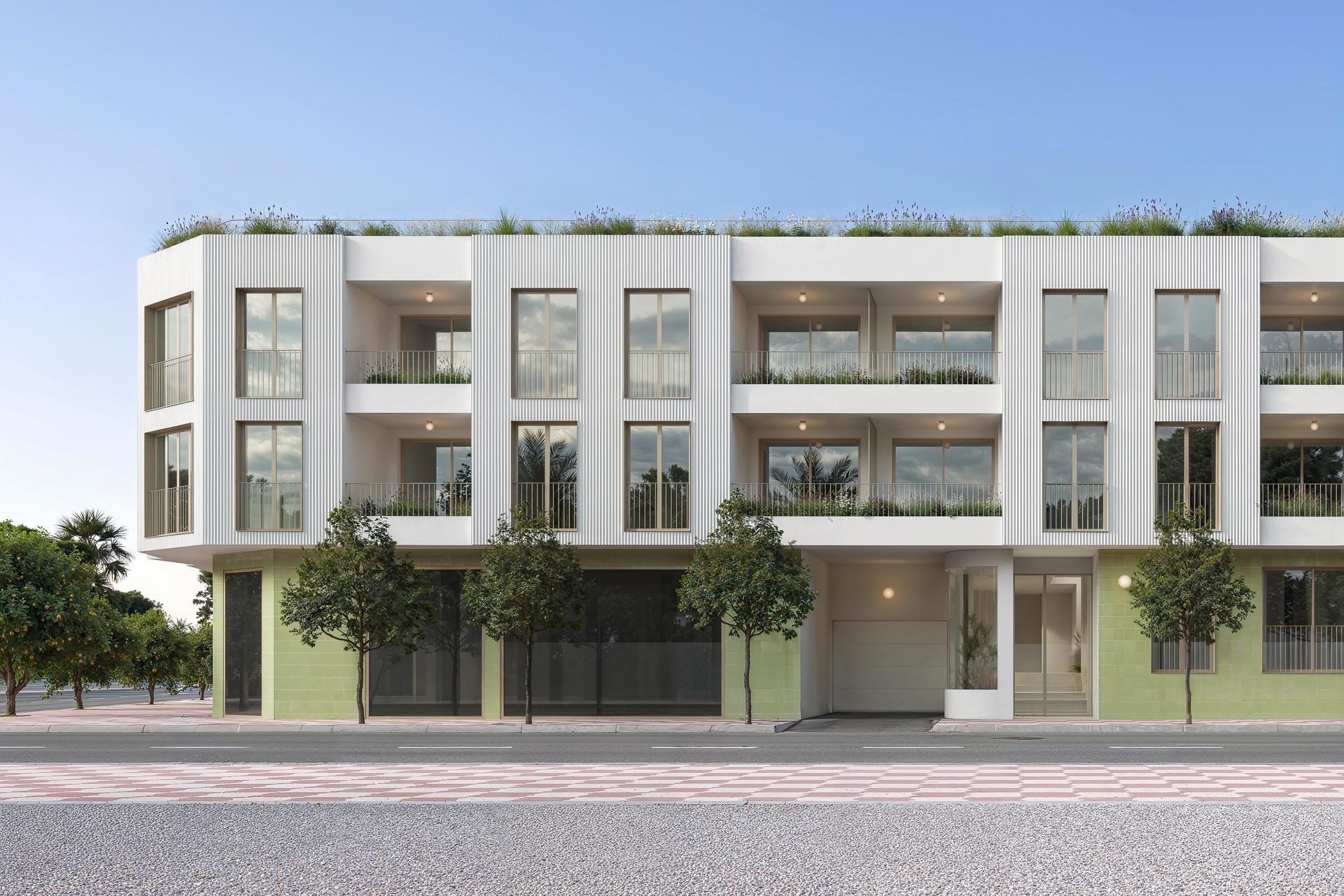 Modern, elegant new build 3-bedroom ground floor apartment with private patio in sunny Jacarilla, surrounded by greenery and open sky.