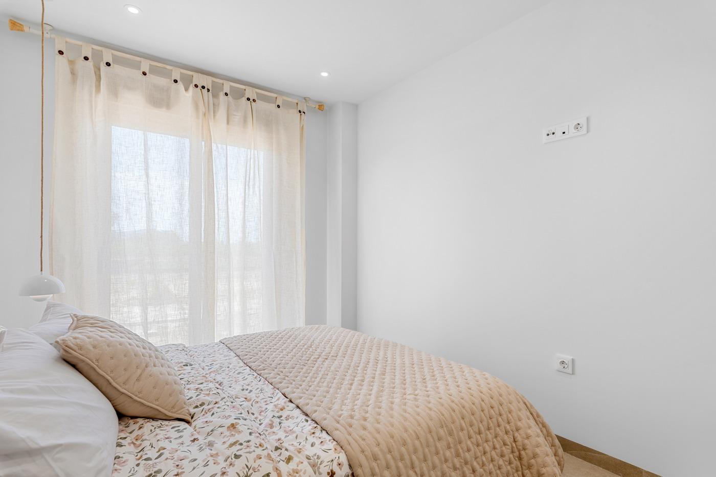 Bright and modern bedroom with soft natural light in a new 3-bedroom penthouse with terrace and open views in Jacarilla