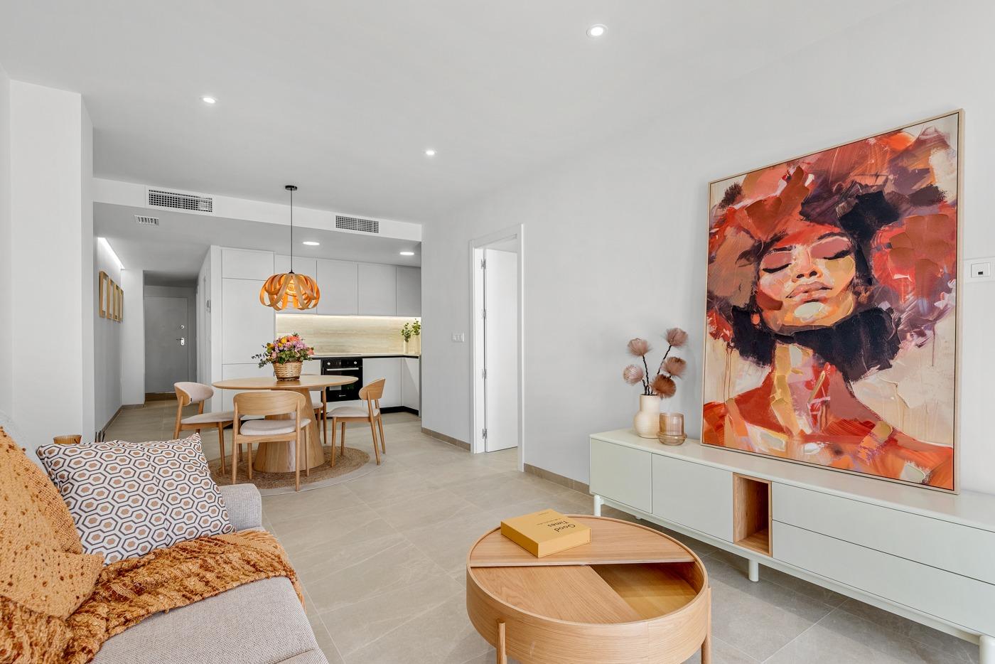 Bright modern open-plan living area in affordable 3 bedroom ground floor apartment with private patio in Jacarilla