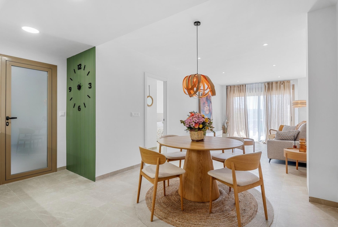 Bright modern open-plan dining and living area in 3-bedroom apartment with elegant decor and sunlit terraces in Jacarilla.