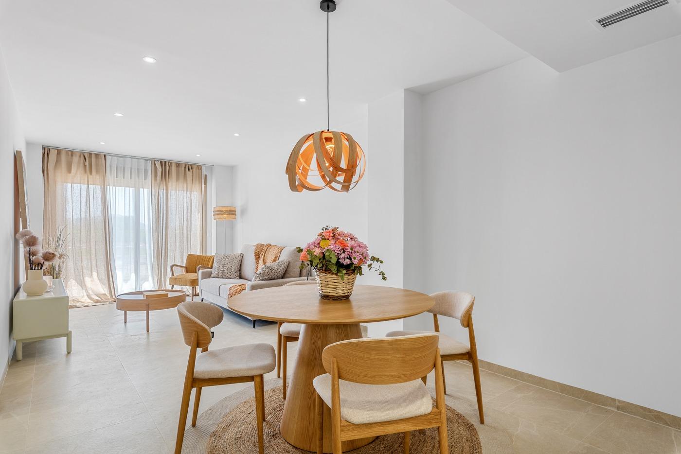 Bright modern ground floor living and dining area in a new 3-bedroom apartment with private patio in Jacarilla