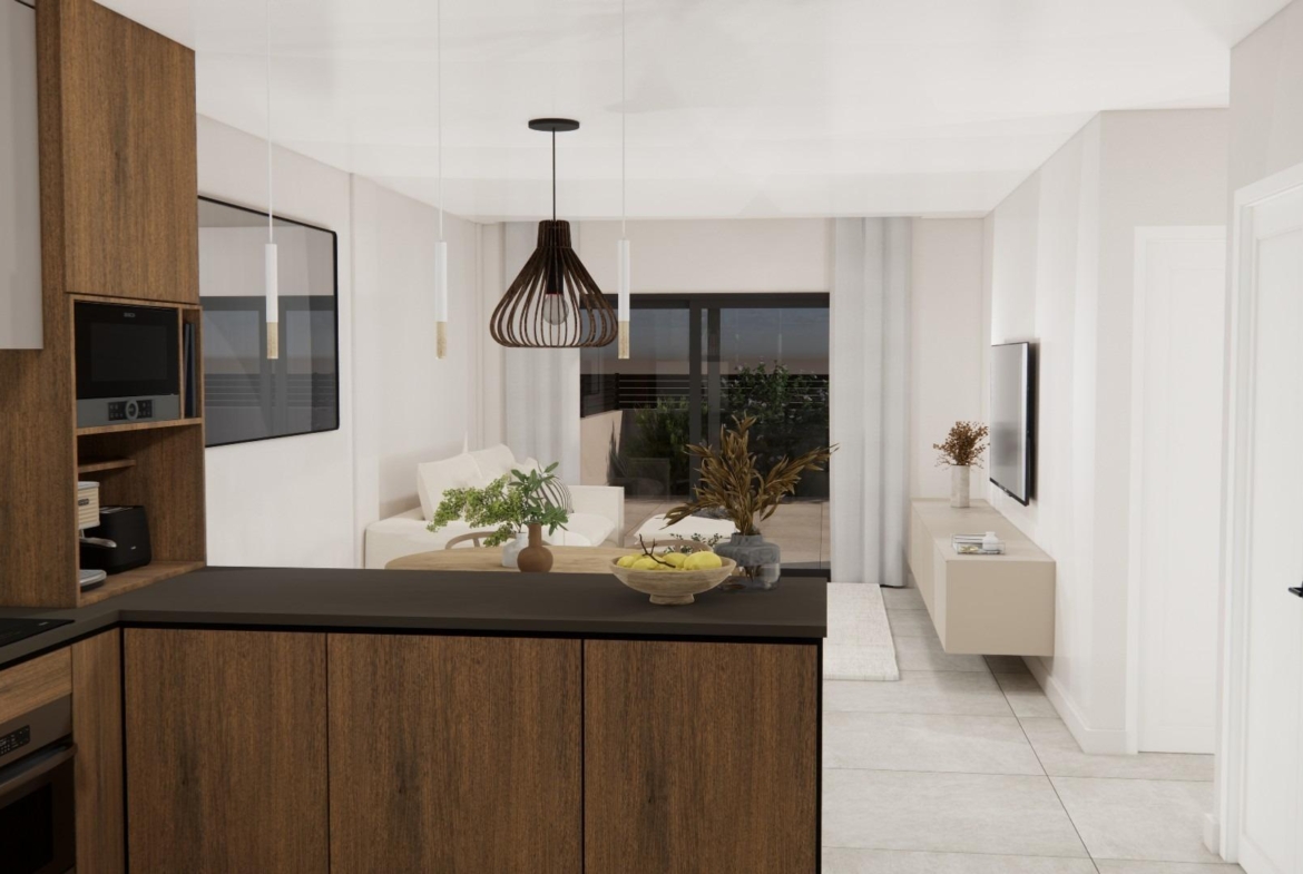 Bright modern open-plan kitchen and living area in a luxury 2-bedroom top floor apartment in Rojales, Costa Blanca South.