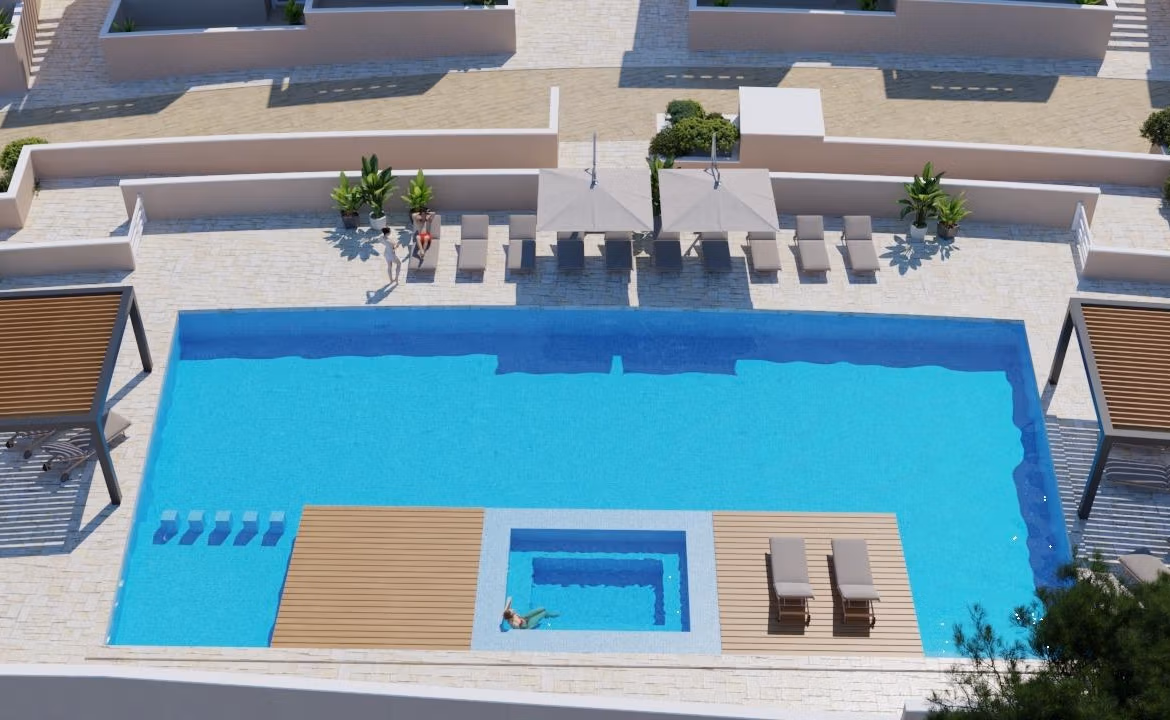 New-Build-Bungalows-in-Lo-Romero-Golf-Resort-Pilar-de-la-Horadada-3 Sun-drenched infinity pool with loungers and shaded pergolas at luxury 3-bedroom top floor apartment, Lo Romero Golf, Pilar de la Horadada.