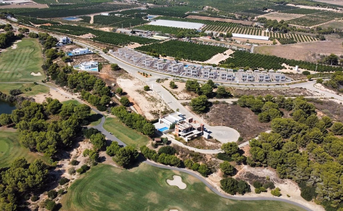 New-Build-Bungalows-in-Lo-Romero-Golf-Resort-Pilar-de-la-Horadada-7 Aerial view of modern 3-bedroom top floor apartments with solariums overlooking lush Lo Romero Golf in Pilar de la Horadada.