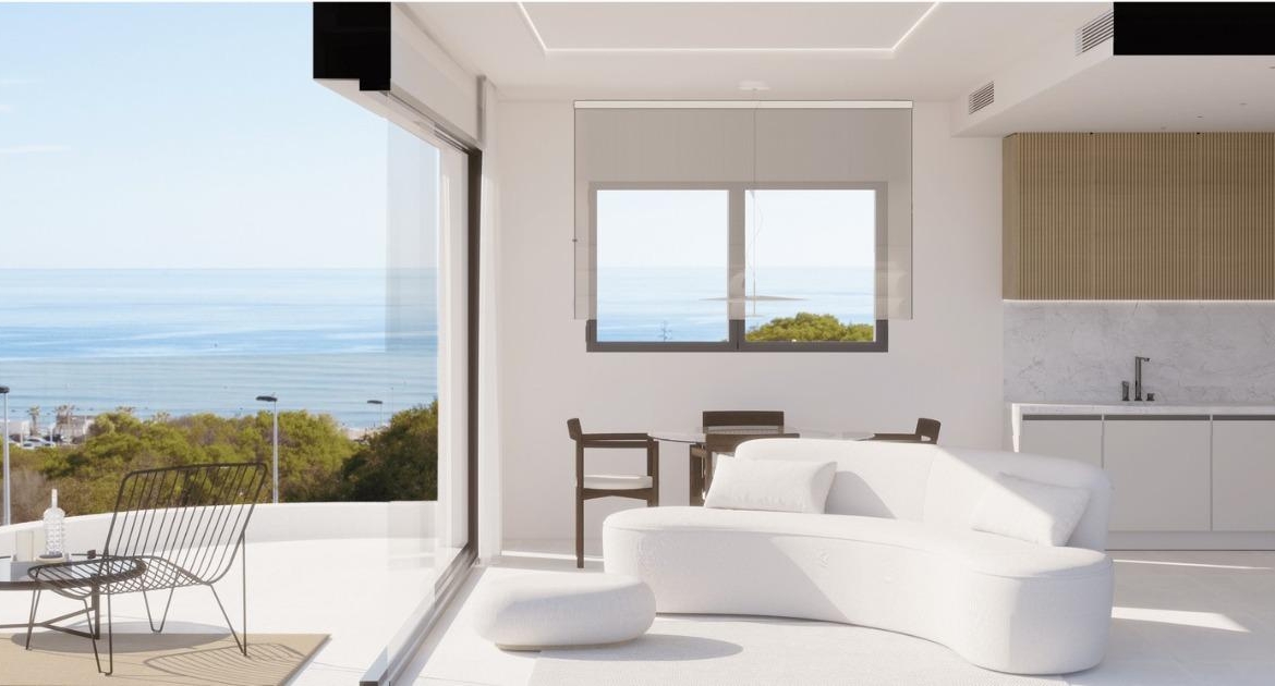 Bright open-plan top floor apartment with sleek kitchen and panoramic sea views in luxury La Mata, Torrevieja development