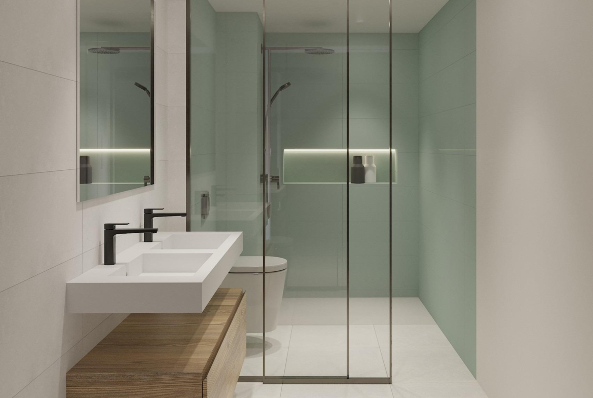 Modern, sleek bathroom with double vanity and glass-enclosed shower in exclusive new build ground floor apartment in La Mata, Torrevieja.