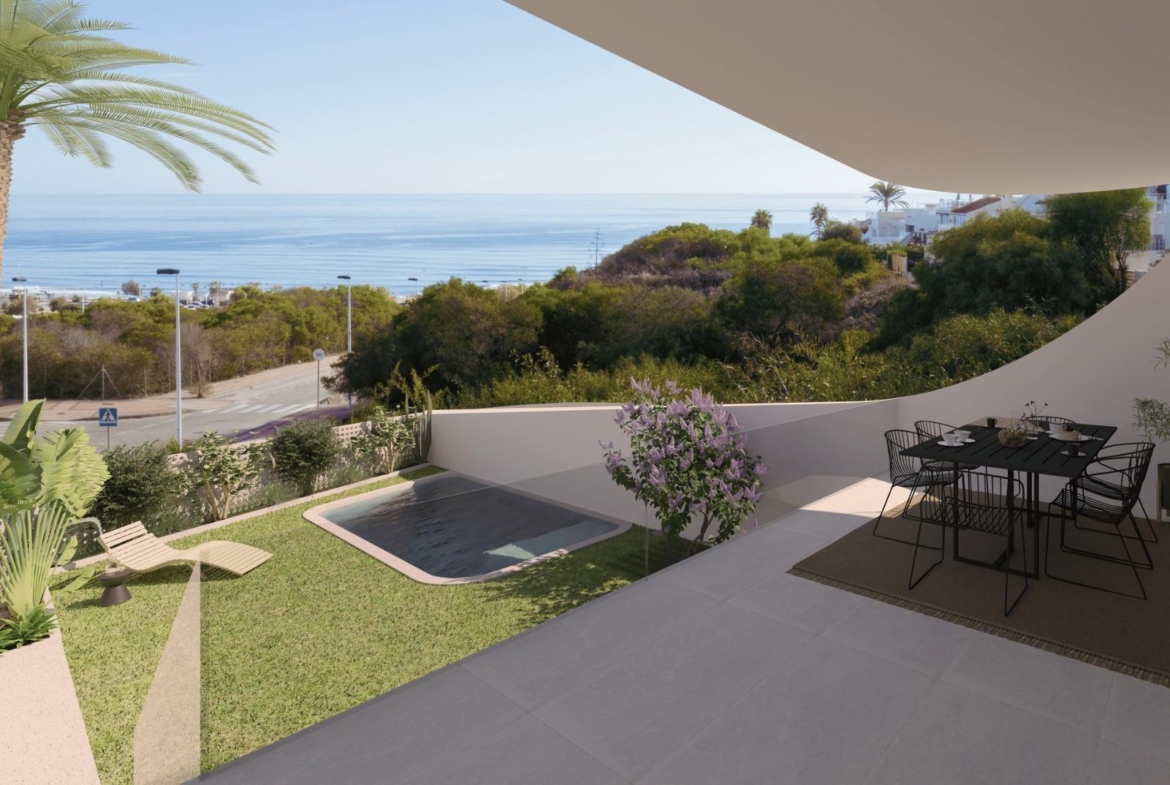 Spacious modern top floor apartment terrace with elegant outdoor dining, private garden, and panoramic sea views in La Mata, Torrevieja