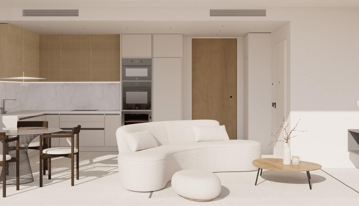 Bright open-plan living and dining area with modern kitchen in luxury top floor apartment in La Mata, Torrevieja