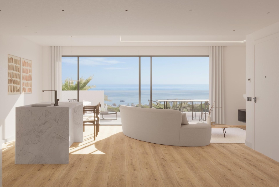 Bright modern top floor apartment living area with marble kitchen island and panoramic sea views in La Mata, Torrevieja.