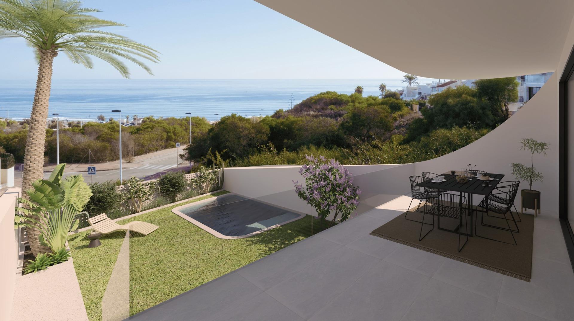 Sun-drenched ground floor apartment terrace with private garden and panoramic sea views in La Mata, Torrevieja.