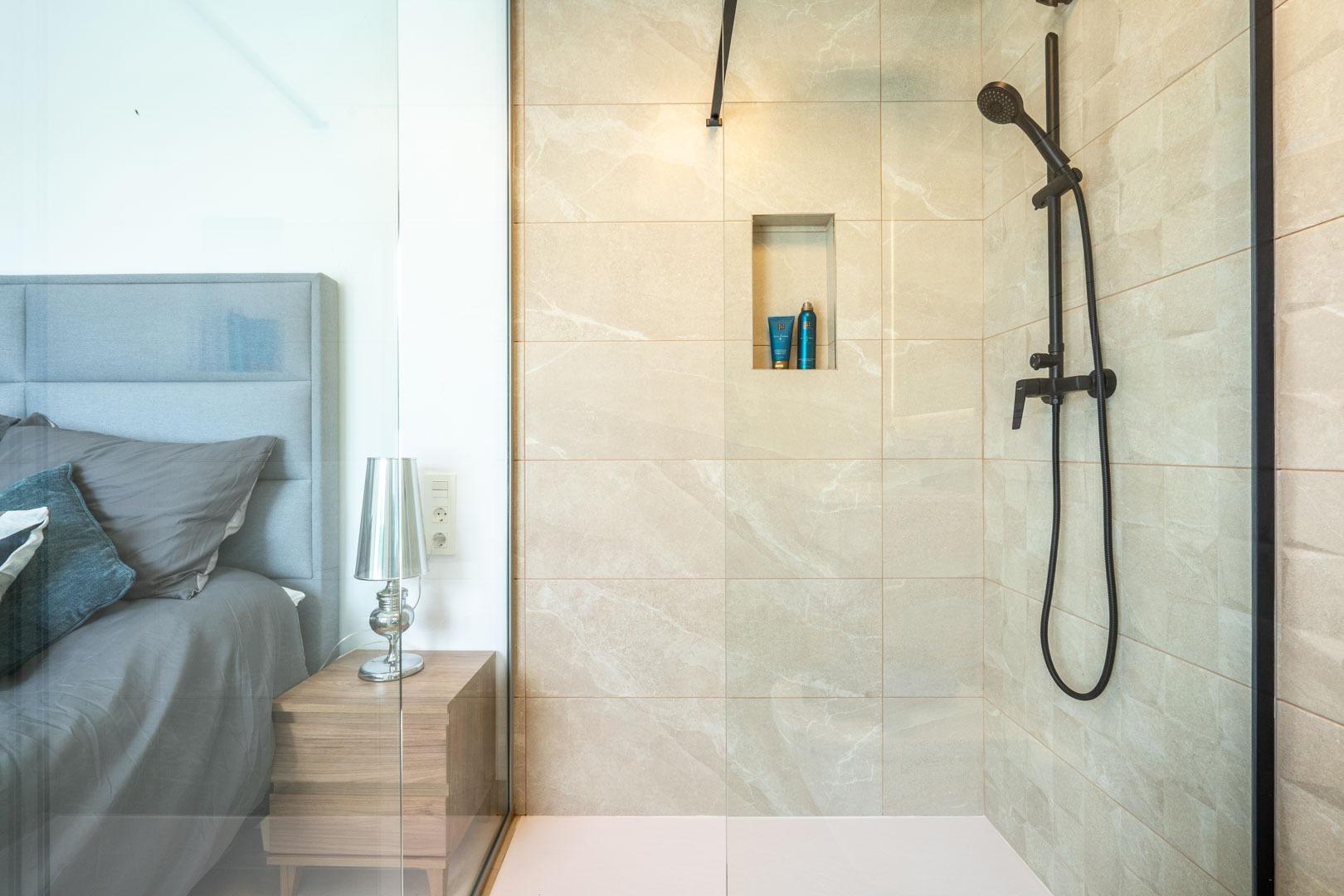 Elegant modern bathroom with sleek walk-in shower and stylish fixtures in Mediterranean new build villa, Roldán Torre-Pacheco.
