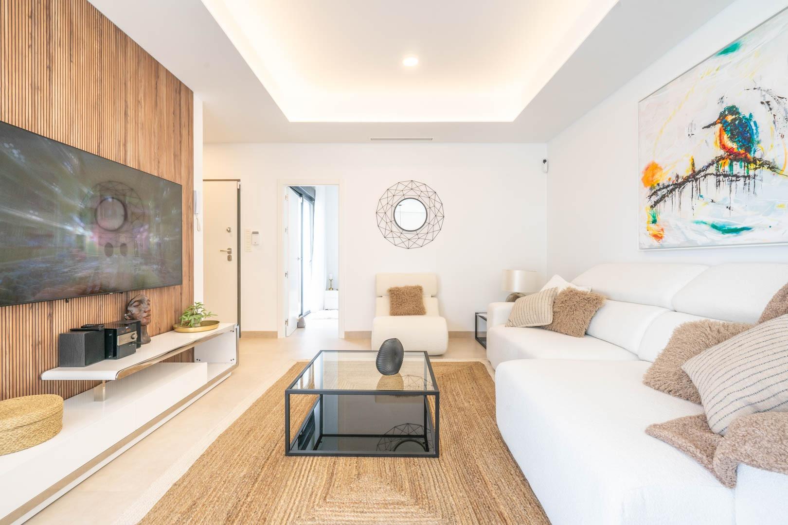 Bright, modern living room with sleek furniture and artistic accents in Mediterranean new build villa, Roldán, Torre-Pacheco.